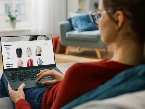 woman viewing online inventory with eCommerce ERP