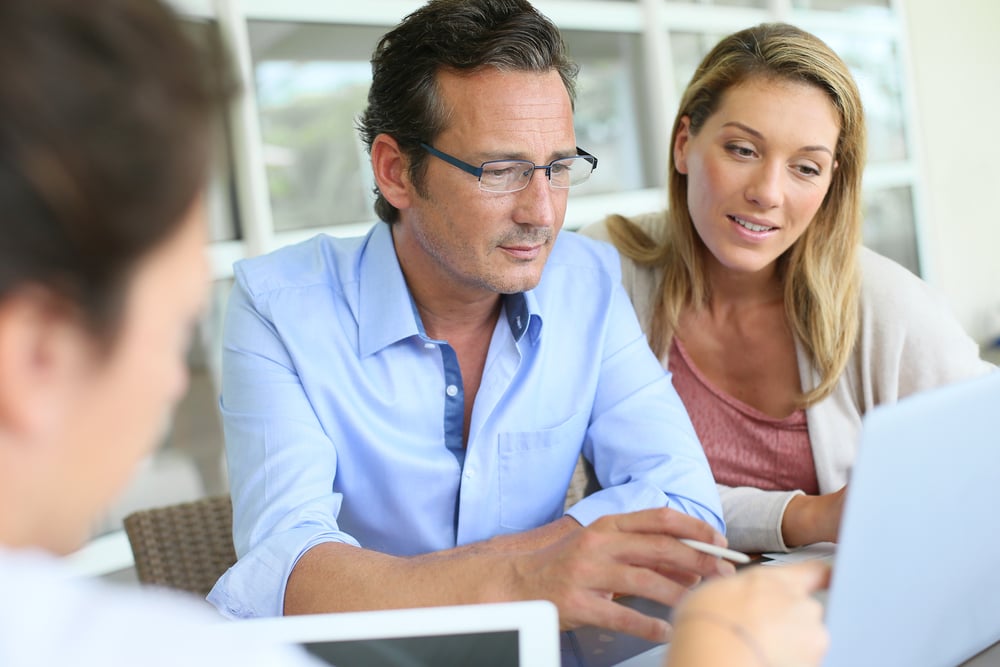 Businesspeople relieved because their eCommerce software is scaling with their small business.