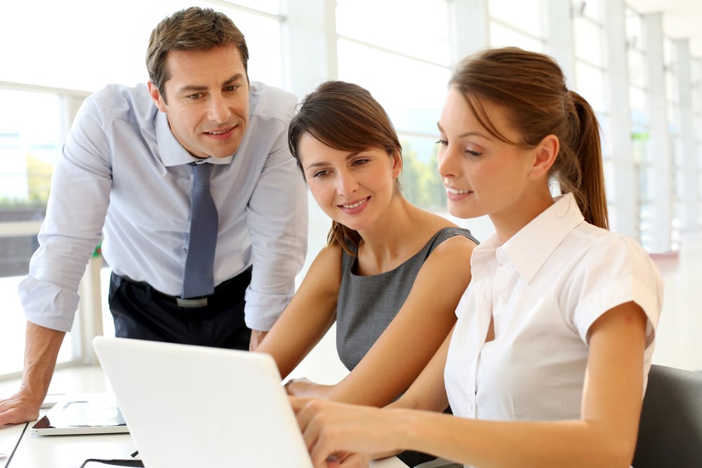 Business team comparing headless or templated software for their eCommerce store.