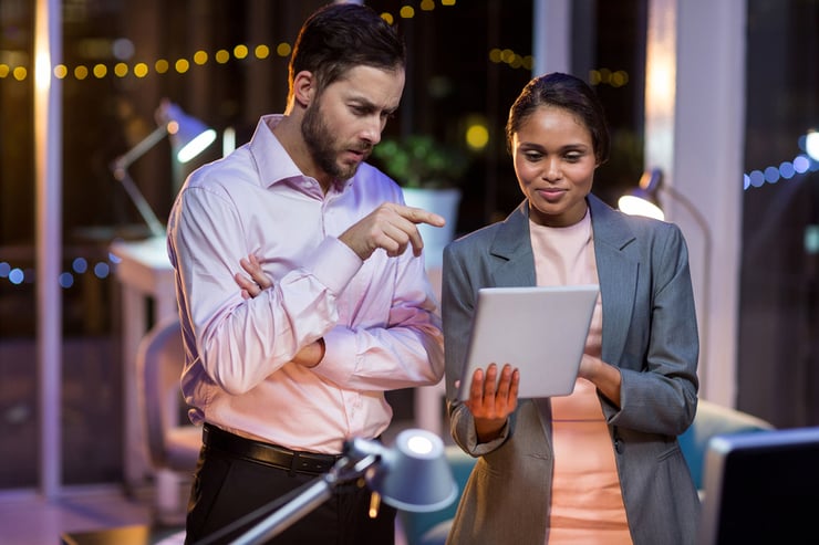 Businesspeople trying to work through problems in their NetSuite ERP system.