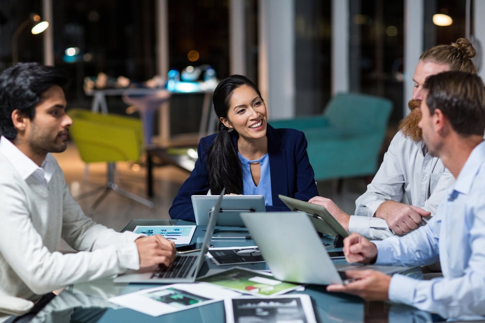 Businesspeople discussing the benefits of Acumatica's pricing structure.
