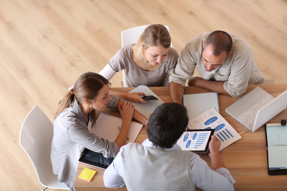 Businesspeople discussing an ERP solution as a QuickBooks alternative.
